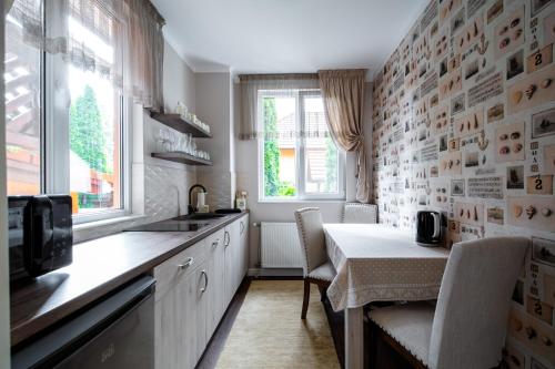 A kitchen or kitchenette at Be my apartman