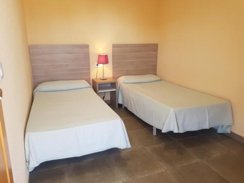 Postel nebo postele na pokoji v ubytování Acuarium 3-Fincas Benidorm