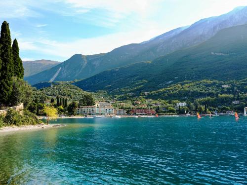 a view of a lake with mountains in the background at Hotel Val Di Sogno - Adults Only in Malcesine