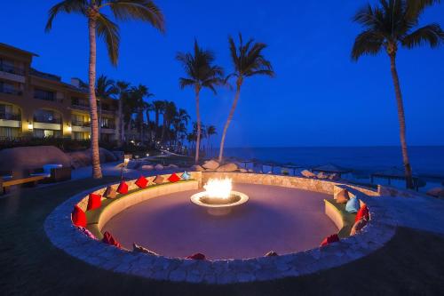 a fire pit in the middle of the beach at night at Grand Fiesta Americana Los Cabos All Inclusive Golf & Spa in Cabo San Lucas