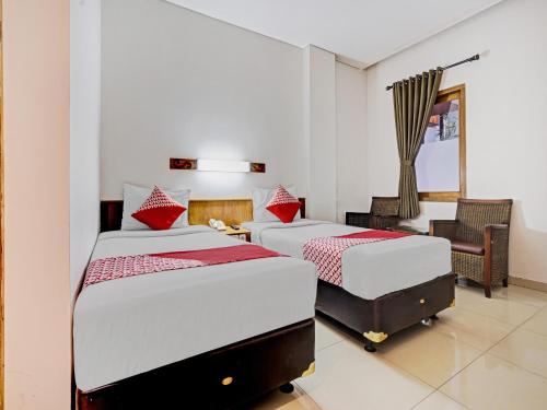 Tempat tidur dalam kamar di Super OYO Flagship 90501 Hotel Montameri