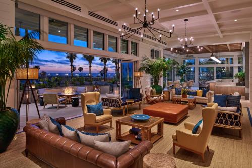 a large living room with couches and chairs at The Seabird Ocean Resort & Spa, Part of Destination Hotel by Hyatt in Oceanside