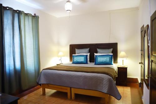 Ένα ή περισσότερα κρεβάτια σε δωμάτιο στο Suites Santo Domingo