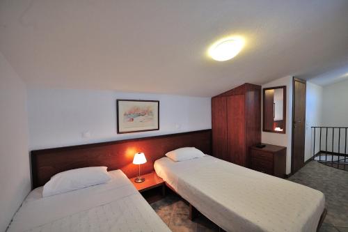 Postel nebo postele na pokoji v ubytování Eye Q Resort Seaview