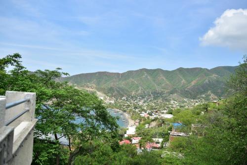 a view of a town with mountains in the background at Perth House Taganga in Taganga