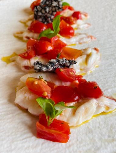 a group of food on a white plate at Antica Locanda Del Villoresi in Nerviano