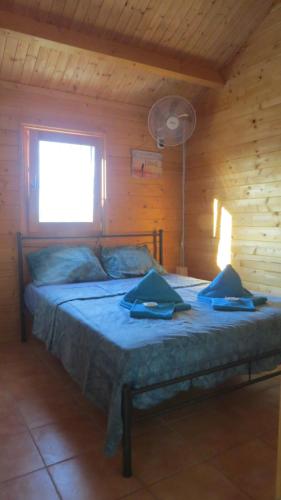 מיטה או מיטות בחדר ב-Villa Soroni