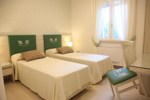 En eller flere senge i et værelse på La Dimora degli Angeli