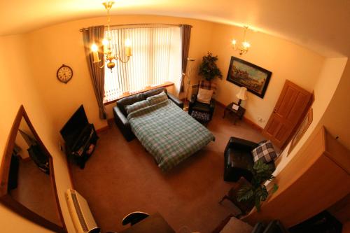 an overhead view of a living room with a couch at Glenfiddich in Nairn