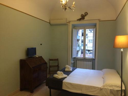 Posteľ alebo postele v izbe v ubytovaní Apt via cernaia center of rome
