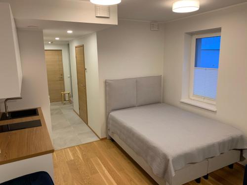 Postel nebo postele na pokoji v ubytování Tiiru 5 Apartment