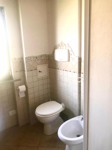 a small bathroom with a toilet and a sink at Appartamento VILLA ADRY in Rome