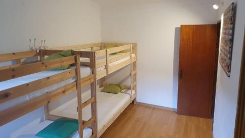a couple of bunk beds in a room at Casa dos Covelos in Ribeira de Pena