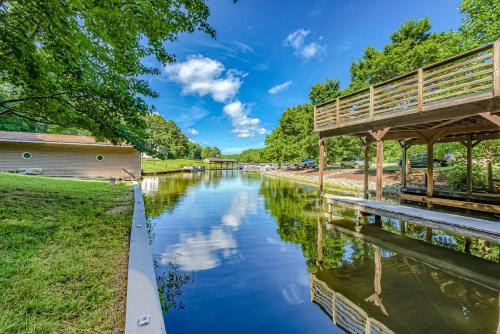 a river with a bridge next to a park at Patel's Cozy Cabin in Glenora