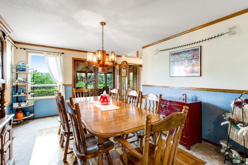 a dining room with a wooden table and chairs at Valley Green in Enumclaw