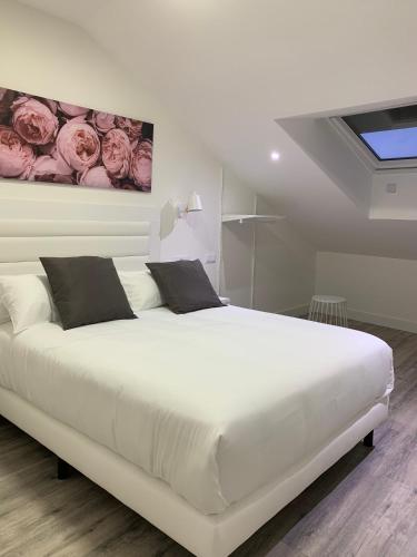 Ένα ή περισσότερα κρεβάτια σε δωμάτιο στο Hostal Comfort Suites