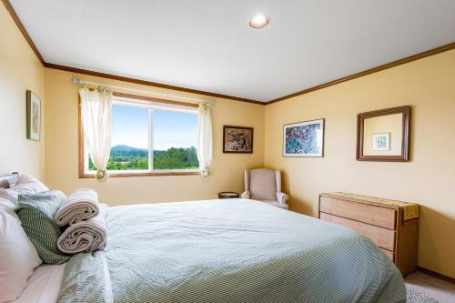 a bedroom with a large bed and a window at Valley Green in Enumclaw