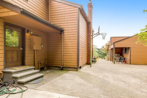 a building with a door and stairs on it at Valley Green in Enumclaw