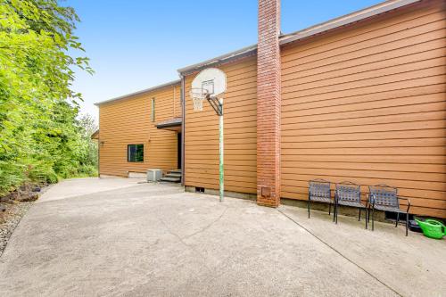 a building with a basketball hoop and two chairs at Valley Green in Enumclaw
