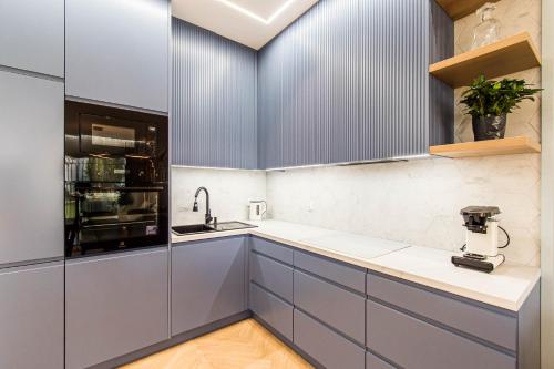 Kuchyň nebo kuchyňský kout v ubytování Nautica Resort - apartament Masurian Sailor