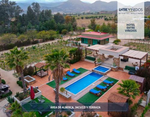 an aerial view of a resort with a swimming pool at Entre Viñedos by Hotel Boutique Valle de Guadalupe in Valle de Guadalupe