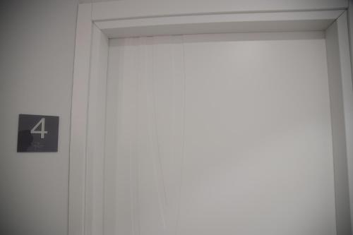 an open door with a number four sign on it at Valenti rooms & relax in Villaggio Mosè