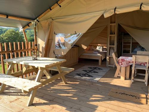 A restaurant or other place to eat at Safari Tent with Hot Tub in heart of Snowdonia