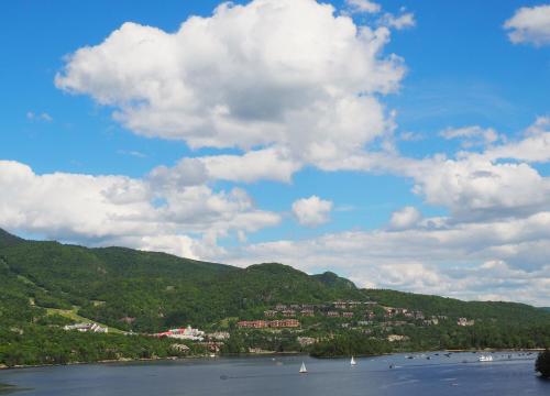 a view of a river with boats in the water at Cozy 2 bedrooms condo with stunning Mont Tremblant mountain and lakeview in Mont-Tremblant