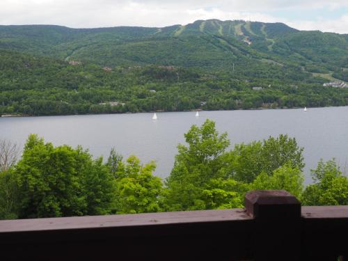 a view of a lake with boats in the water at Cozy 2 bedrooms condo with stunning Mont Tremblant mountain and lakeview in Mont-Tremblant