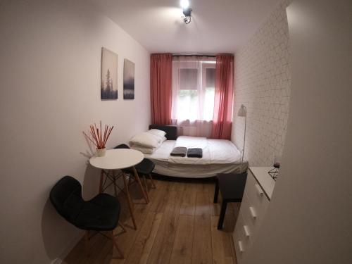 Posteľ alebo postele v izbe v ubytovaní APARTAMENT GDAŃSK ŚRÓDMIEŚCIE