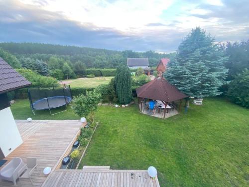 an aerial view of a yard with a gazebo at VILLA DANUTA- WISELKA, direct at National Park, big garden, 4 bedrooms, private SAUNA in Wisełka