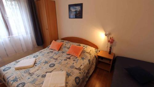A bed or beds in a room at Apartment Porat 22