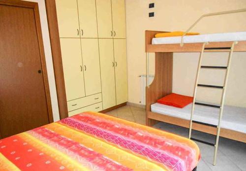 Postel nebo postele na pokoji v ubytování Apartment Rosolina Mare 5