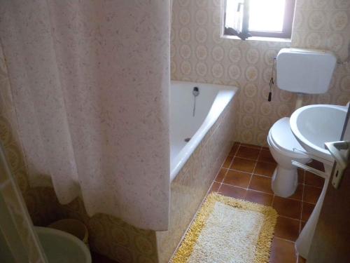 a bathroom with a tub and a toilet and a sink at Apartment in Kampor/Insel Rab 16142 in Kampor