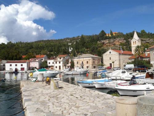 a group of boats are docked in a harbor at Apartment Jablanac/Velebit Riviera 17115 in Jablanac