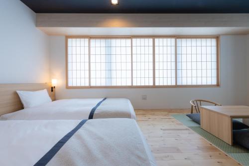 Cama o camas de una habitación en Tosei Hotel Cocone Asakusa Kuramae