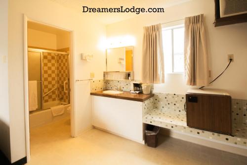 a bathroom with a sink and a shower at Dreamers Lodge in John Day