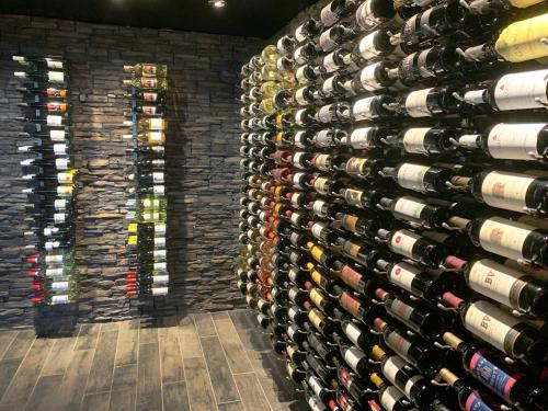 a large wall of wine bottles in a wine cellar at Superior Shores Resort in Two Harbors