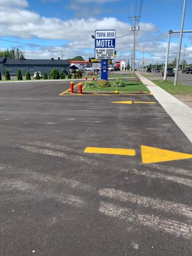 an empty parking lot with a motel sign on it at Trunk Road Motel in Sault Ste. Marie
