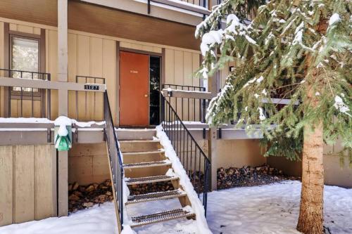 a snow covered staircase leading to a house at Hot Tub & Sauna PEAK 8 BRECKENRIDGE in Breckenridge