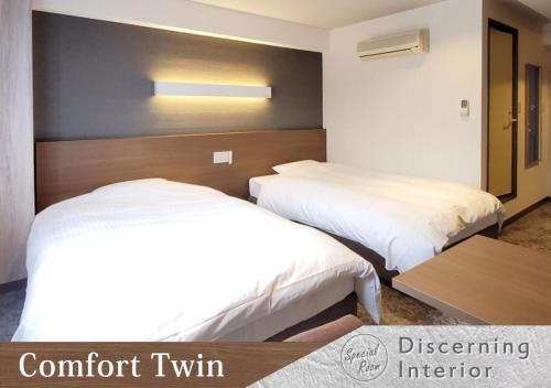 Postel nebo postele na pokoji v ubytování Forest Inn Gobo