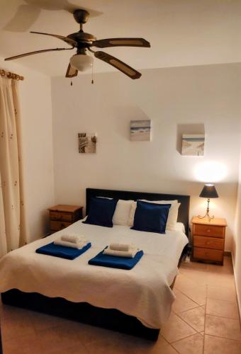a bedroom with a bed with two trays on it at Villa Oliandra in Vilamoura