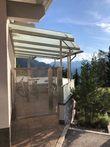 a pergola with a bike inside of it at Ferienwohnung Gritsch Sommercard inclusive in Jerzens