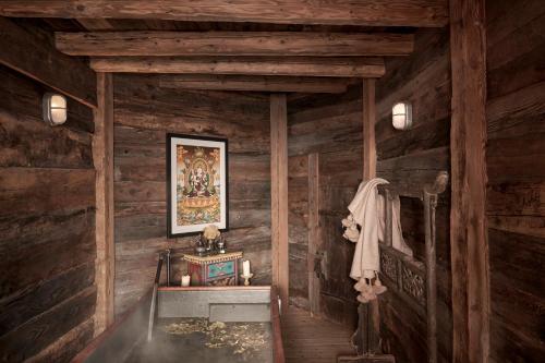 a bathroom with a sink in a wooden cabin at CERVO Mountain Resort in Zermatt