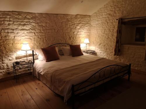 Säng eller sängar i ett rum på La Maison Verger