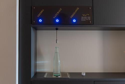 a glass vase sitting on top of a machine at Modica Boutique Hotel in Modica