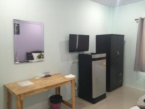 Televízia a/alebo spoločenská miestnosť v ubytovaní Maehaad Guesthouse