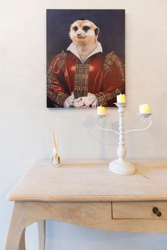 a painting of a meerkat on a table at Palazzo Badiale history&rooms in Atella