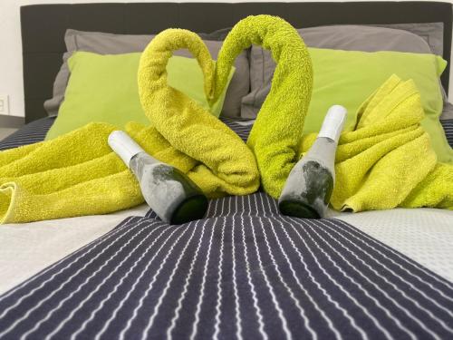 a bed with two towels and two swans on it at Las Mimosas Beach Sol in Puerto del Carmen