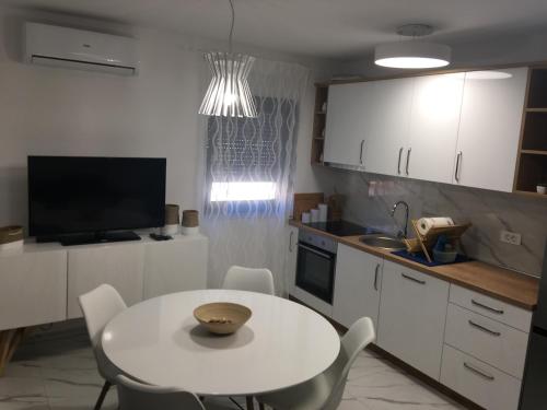 Kuchyň nebo kuchyňský kout v ubytování Apartmani Zlata